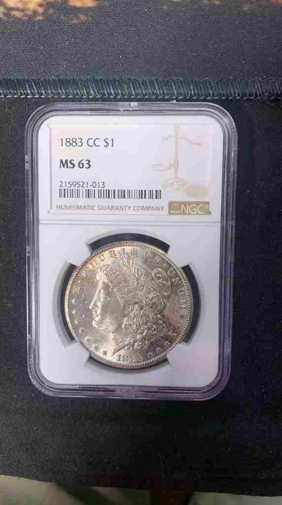 1883-CC Morgan Silver Dollar certified NGC MS63 from the Carson City Mint with the famous CC mint mark.