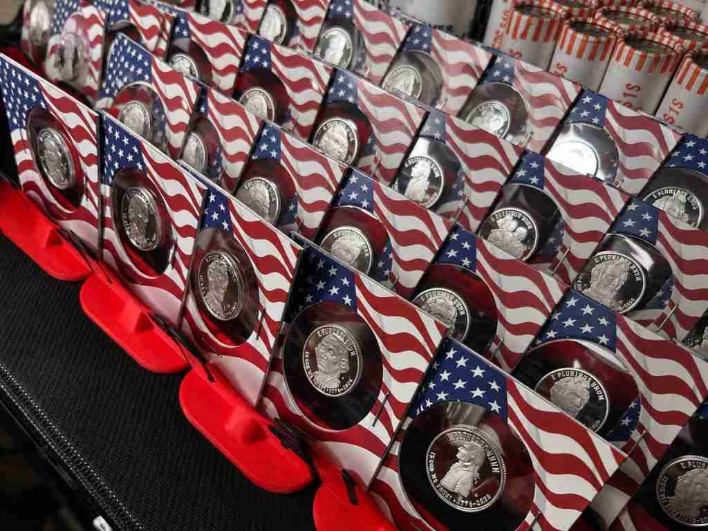 Rows of 2026 Coins displayed in patriotic packaging for America's 250th Anniversary Coin Program