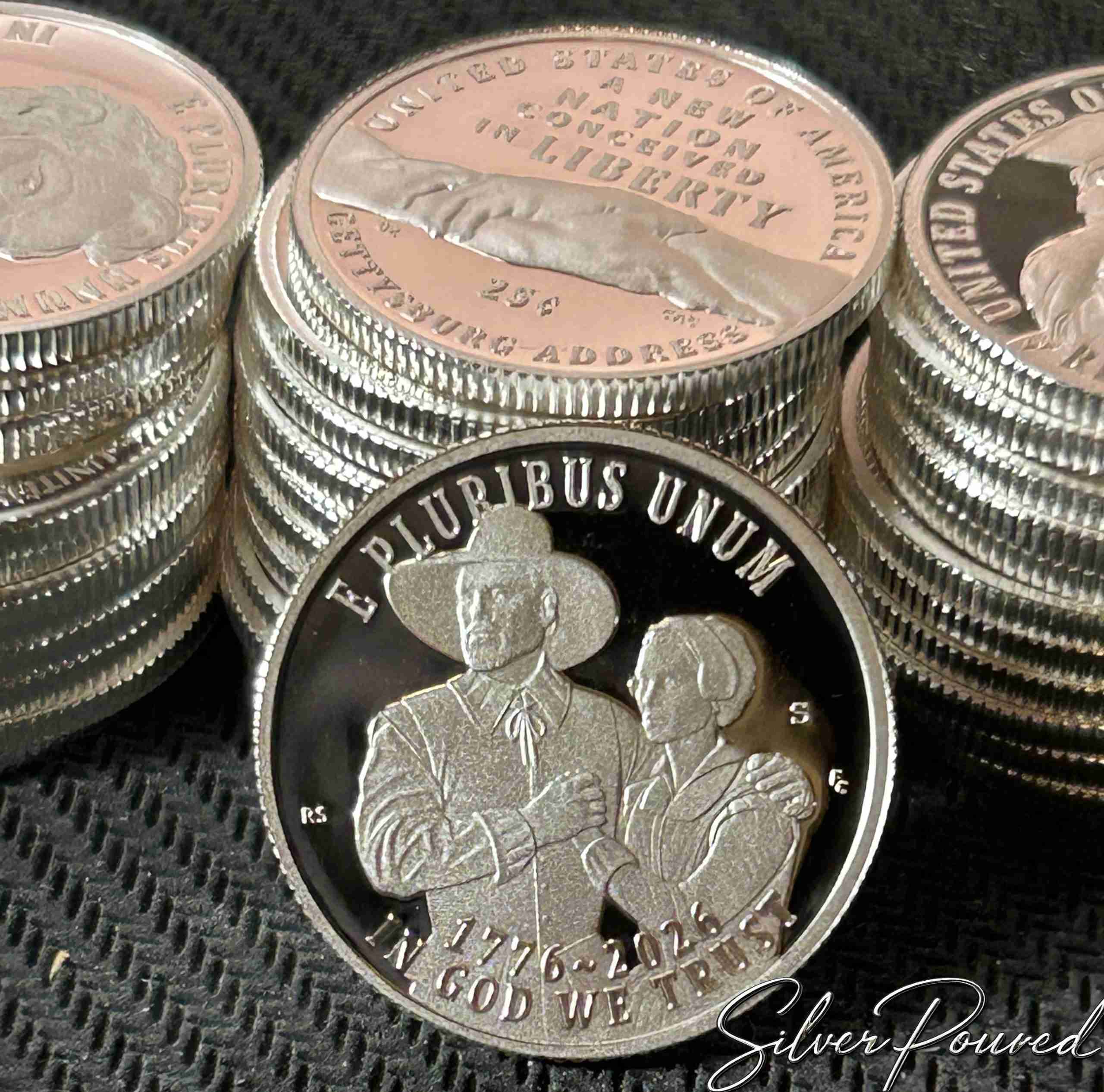 2026 Mayflower Compact silver proof quarter obverse showing two Pilgrims embracing as they behold the New World