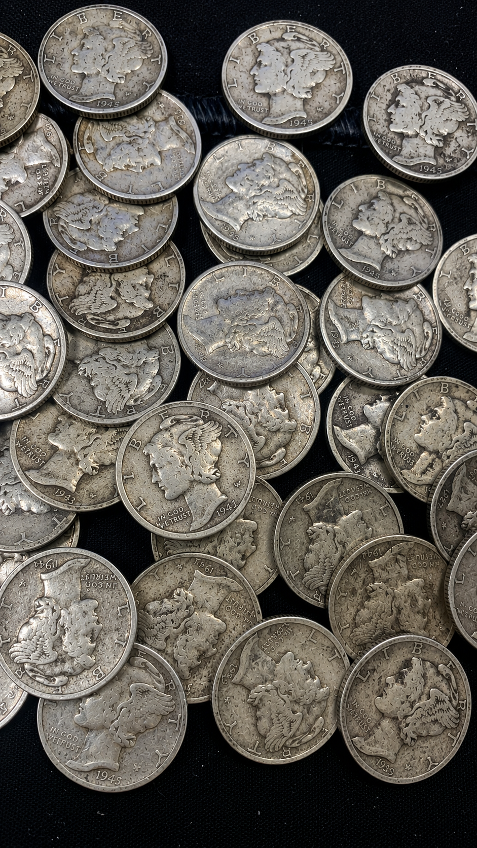 Mixed lot of Mercury dimes dated 1941 through 1945 showing circulated 90 percent silver Winged Liberty Head dimes