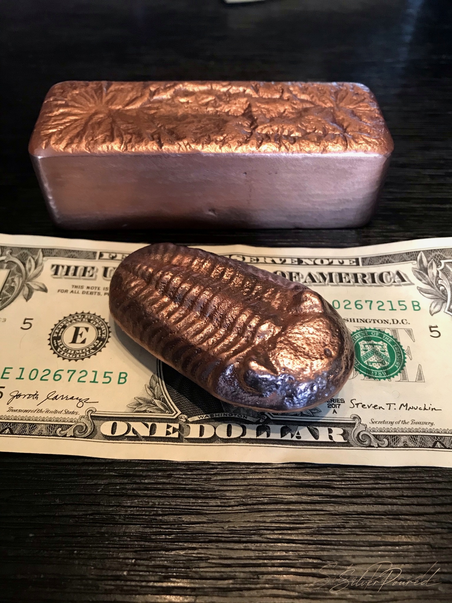 Hand poured copper bars shown with scale and size reference