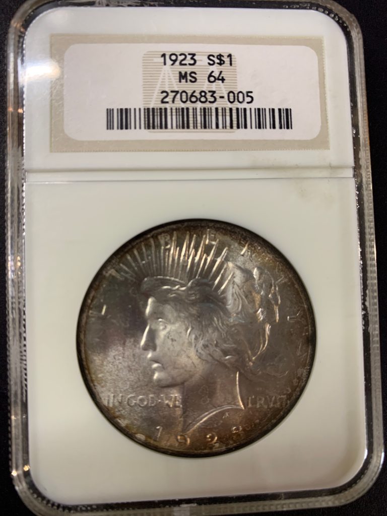 1923 Peace Dollar NGC MS64 obverse with natural rainbow toning