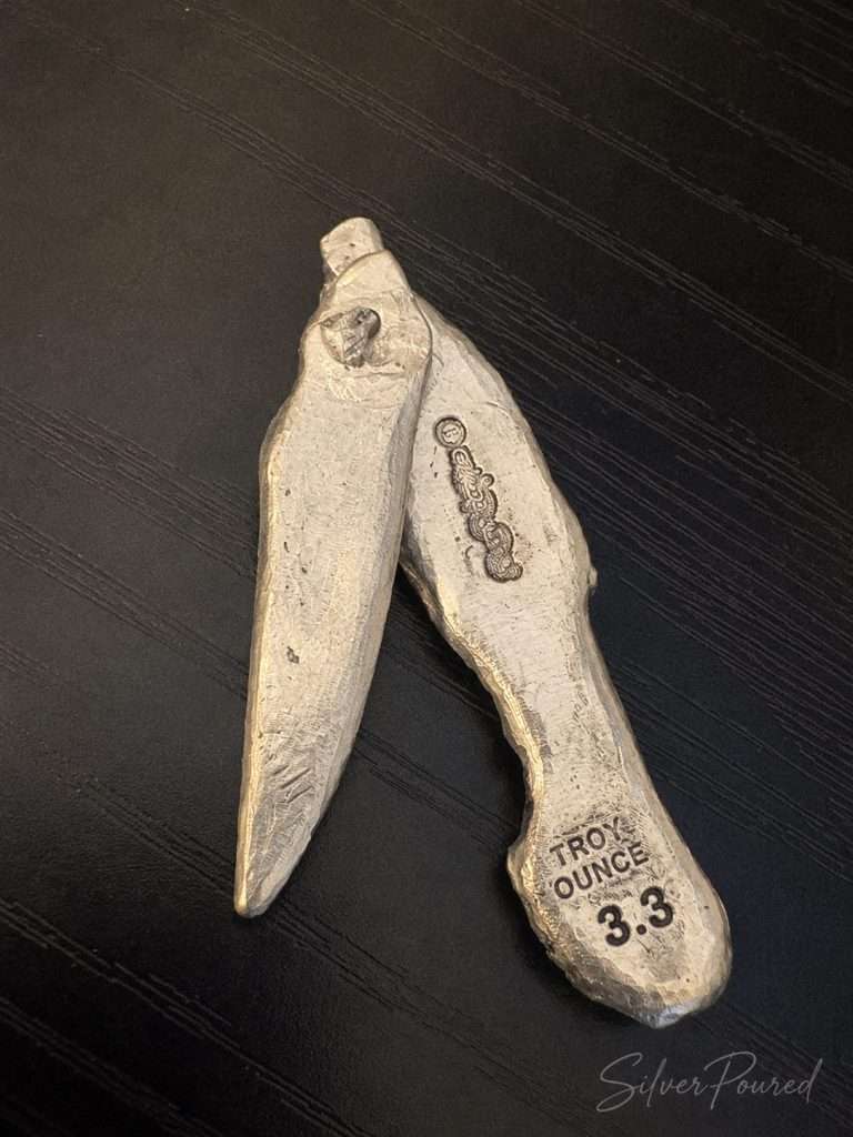 3.3 oz .999 hand poured silver folding pocket knife back view open, showcasing handcrafted silver artistry and collectible hand poured silver.