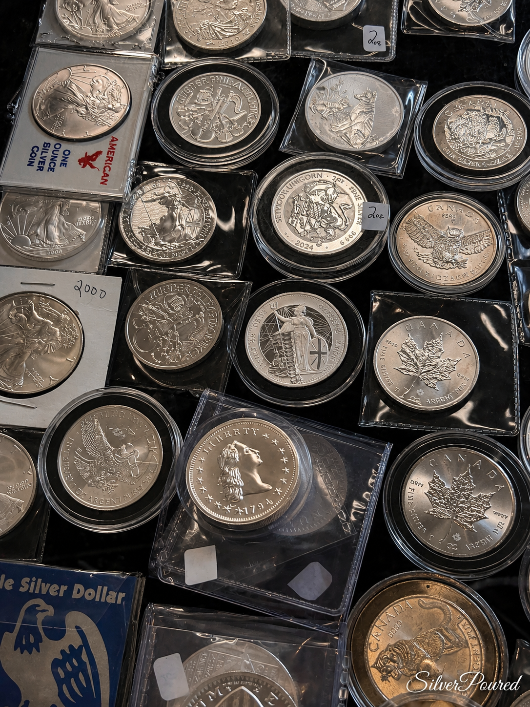 Assorted one ounce silver bullion products showing different premiums above silver value