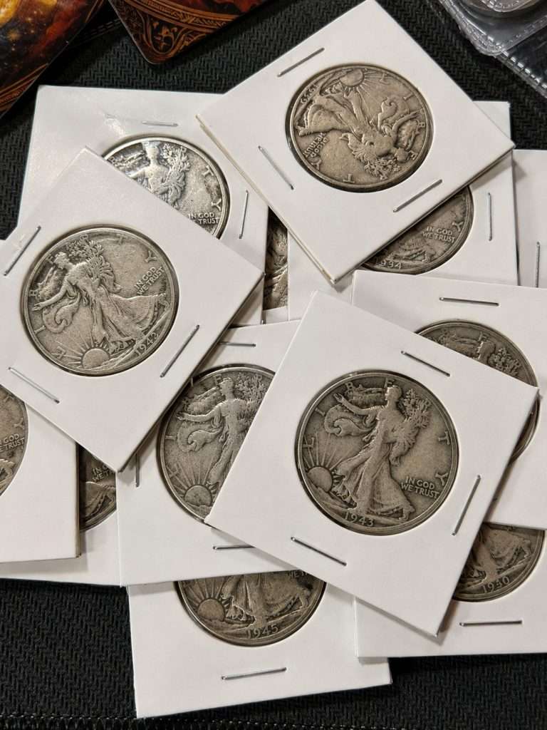 Walking Liberty half dollar silver coin lot featuring multiple 90% silver U.S. half dollars in protective cardboard holders